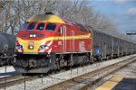 Rock Island heritage unit rolls an outbound commuter into the station